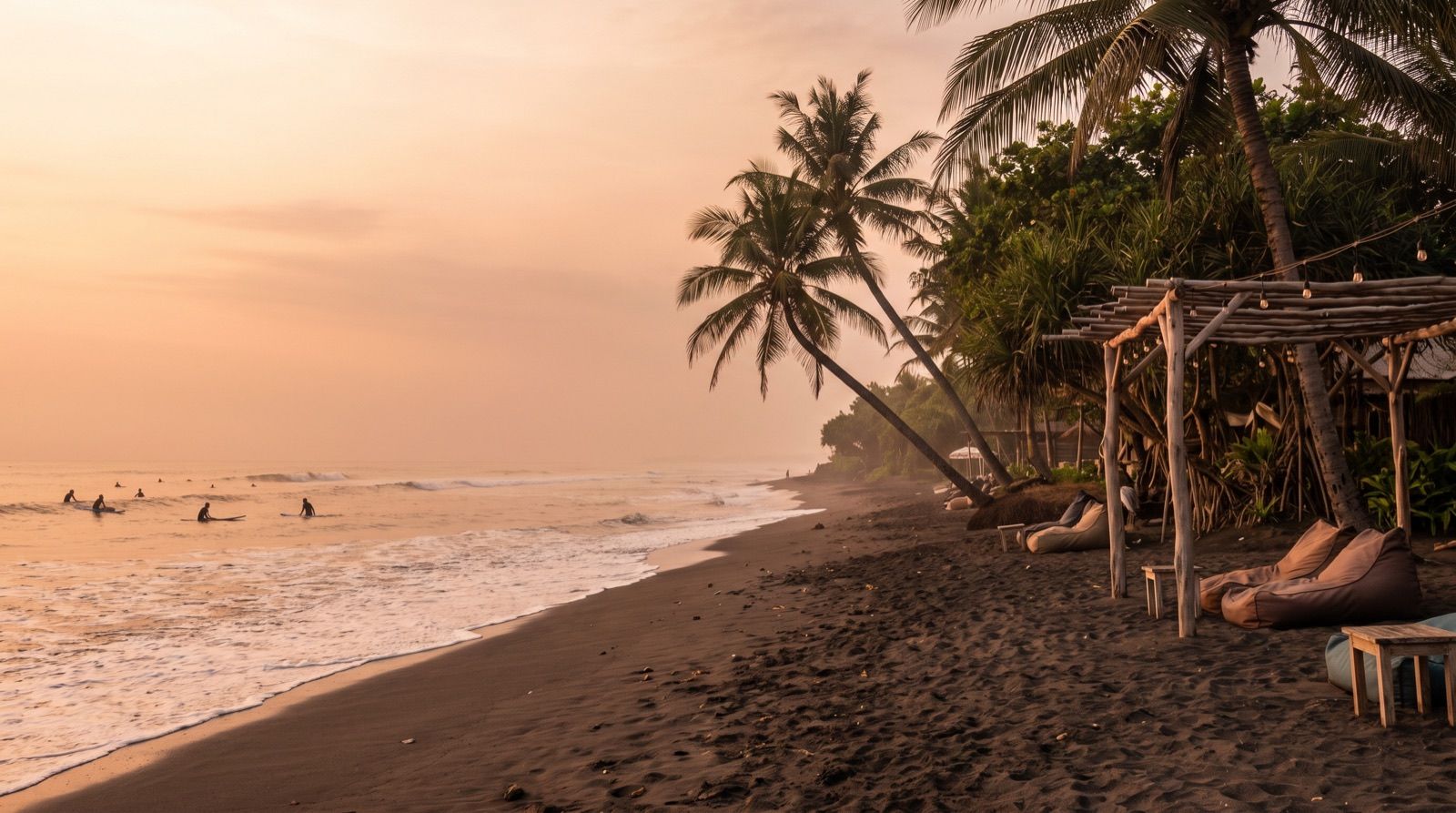 Black-sand surf beach with waves at Canggu, Bali